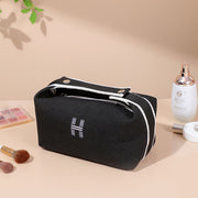 Sophisticated portable premium canvas makeup bag in black, designed by eprolo for optimal storage of cosmetics and toiletries.