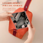 Interior view of eprolo's orange canvas makeup bag, illustrating the layered design for easy storage of makeup and beauty essentials.