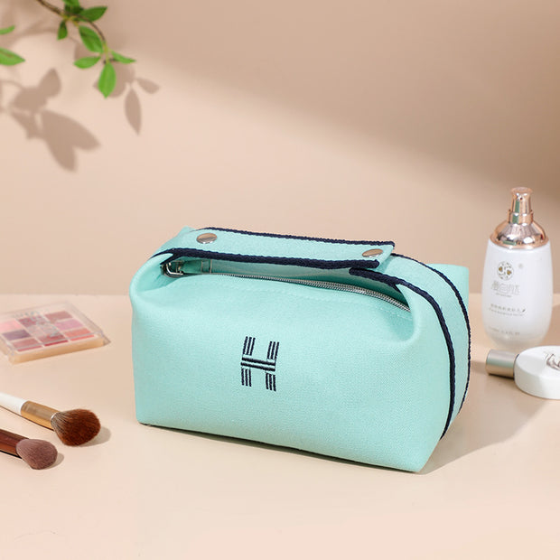 Elegant portable premium canvas makeup bag in mint green, perfect for travel and everyday use, created by eprolo.